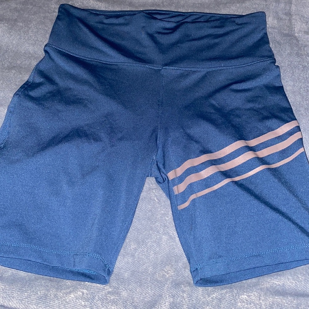 Blue biker shorts with gray stripes